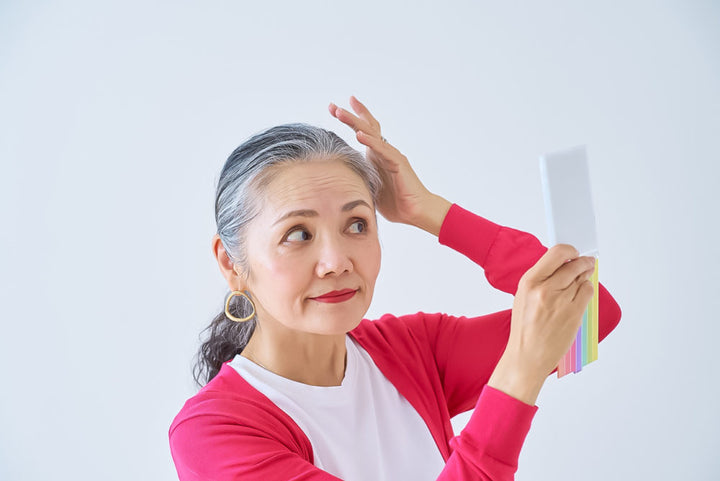 Senior woman looking in the mirror